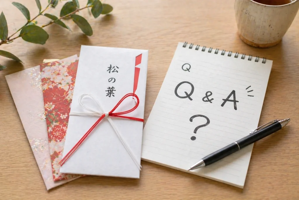 松の葉のし、Q&Aと書かれたメモ帳がテーブルの上に置かれている画像